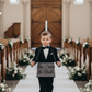 Child with sign - black text version