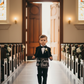 Child with sign - white text version